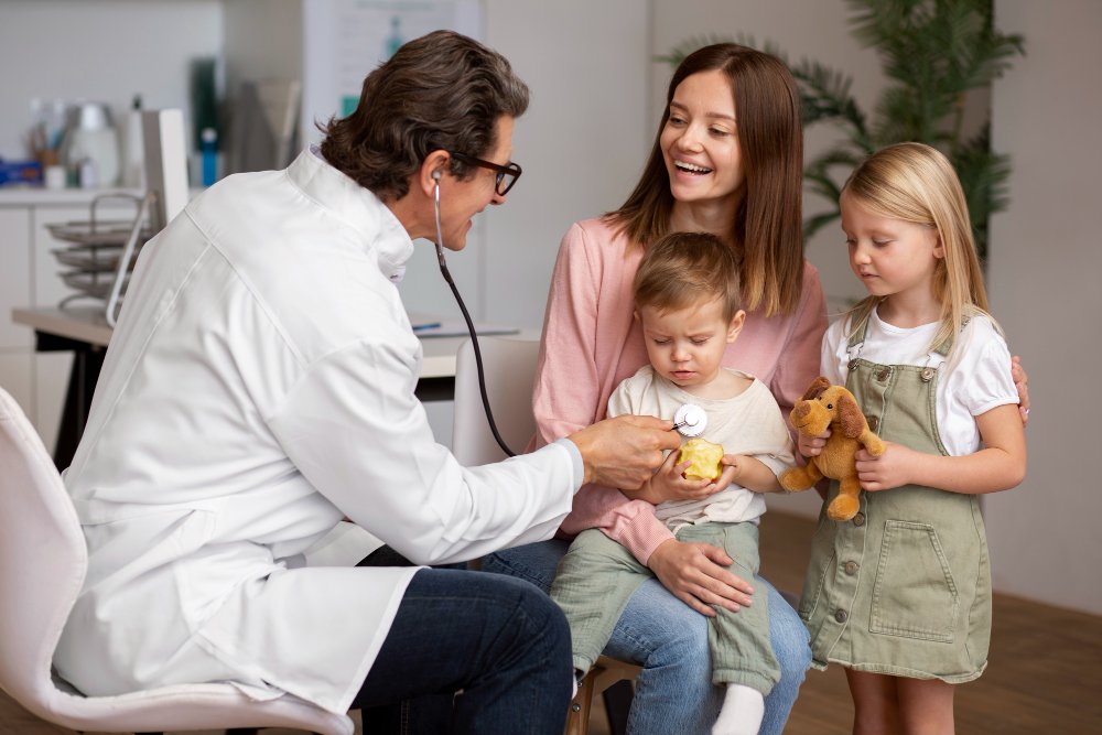 Family checkup in Rancho, California with a doctor examining a young boy.